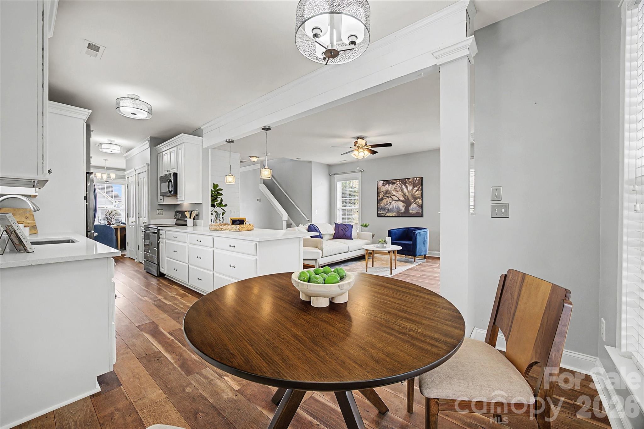 8123 Bud Henderson Road Huntersville, NC 28078 - Photo 16 of 48 a living room with furniture kitchen view and a table