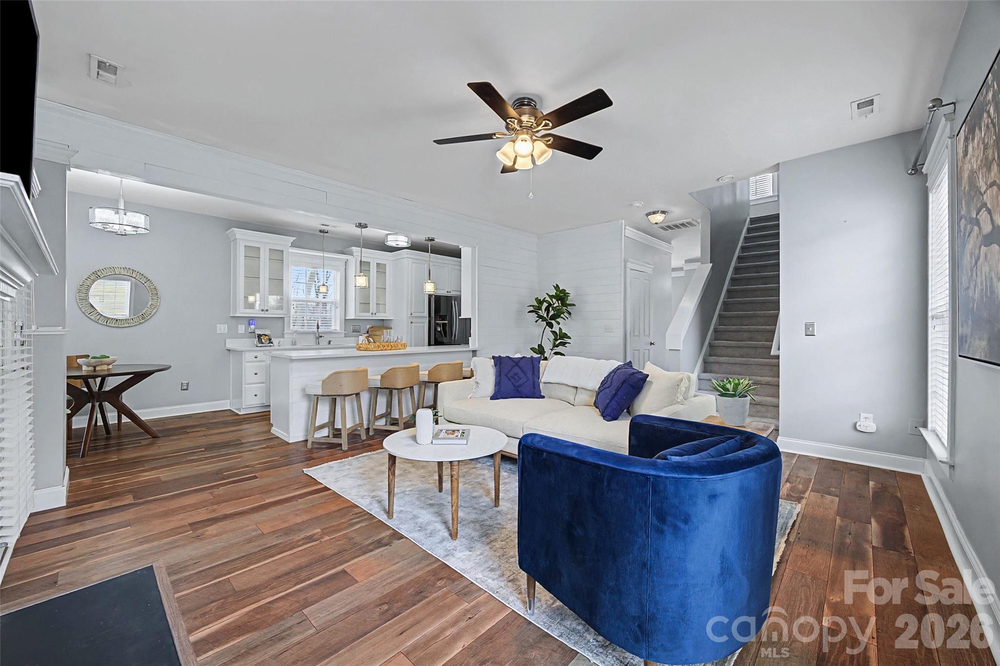 8123 Bud Henderson Road Huntersville, NC 28078 - Photo 19 of 48 a living room with furniture and a wooden floor