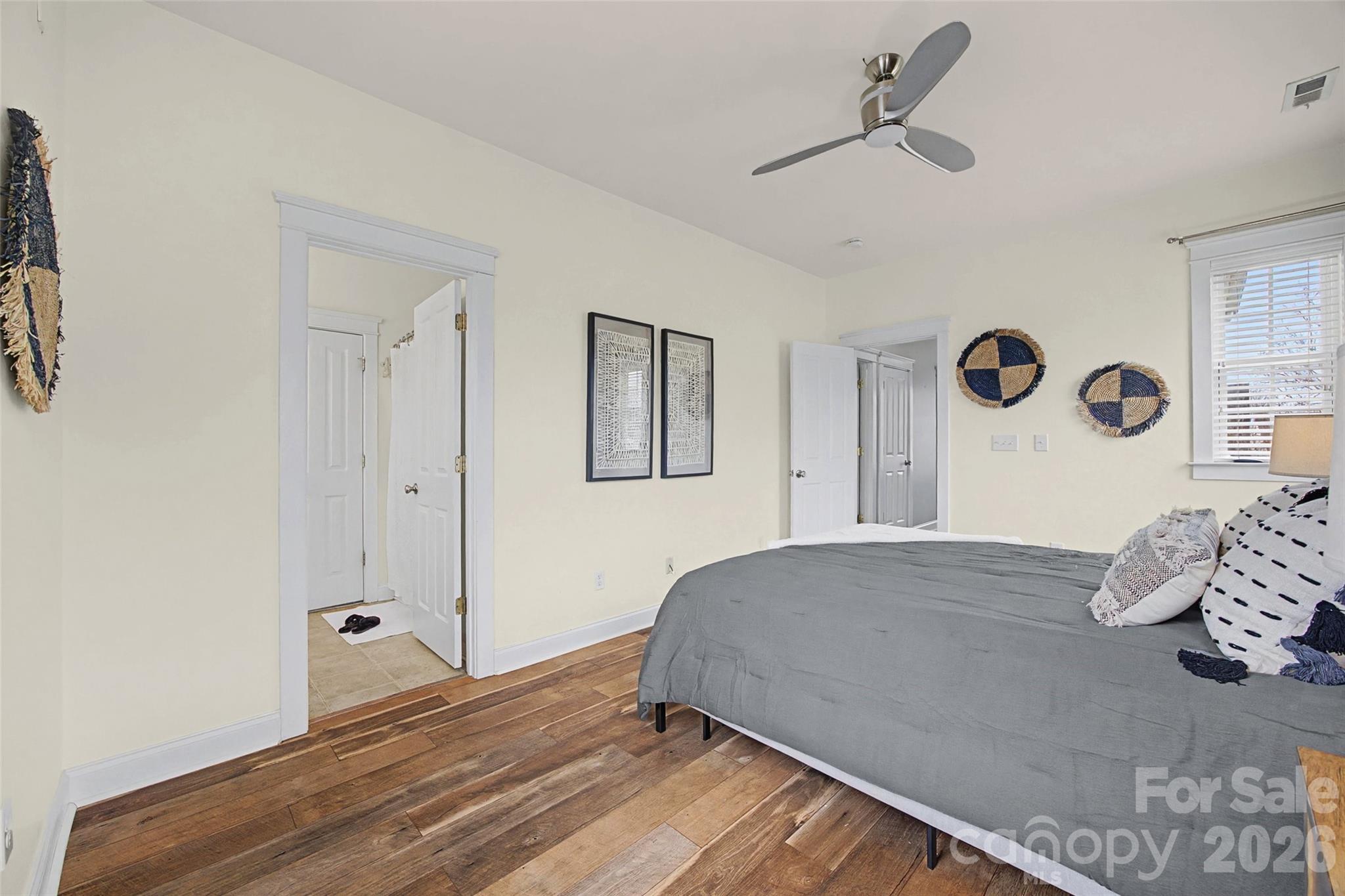 8123 Bud Henderson Road Huntersville, NC 28078 - Photo 26 of 48 a bedroom with a bed and a chandelier