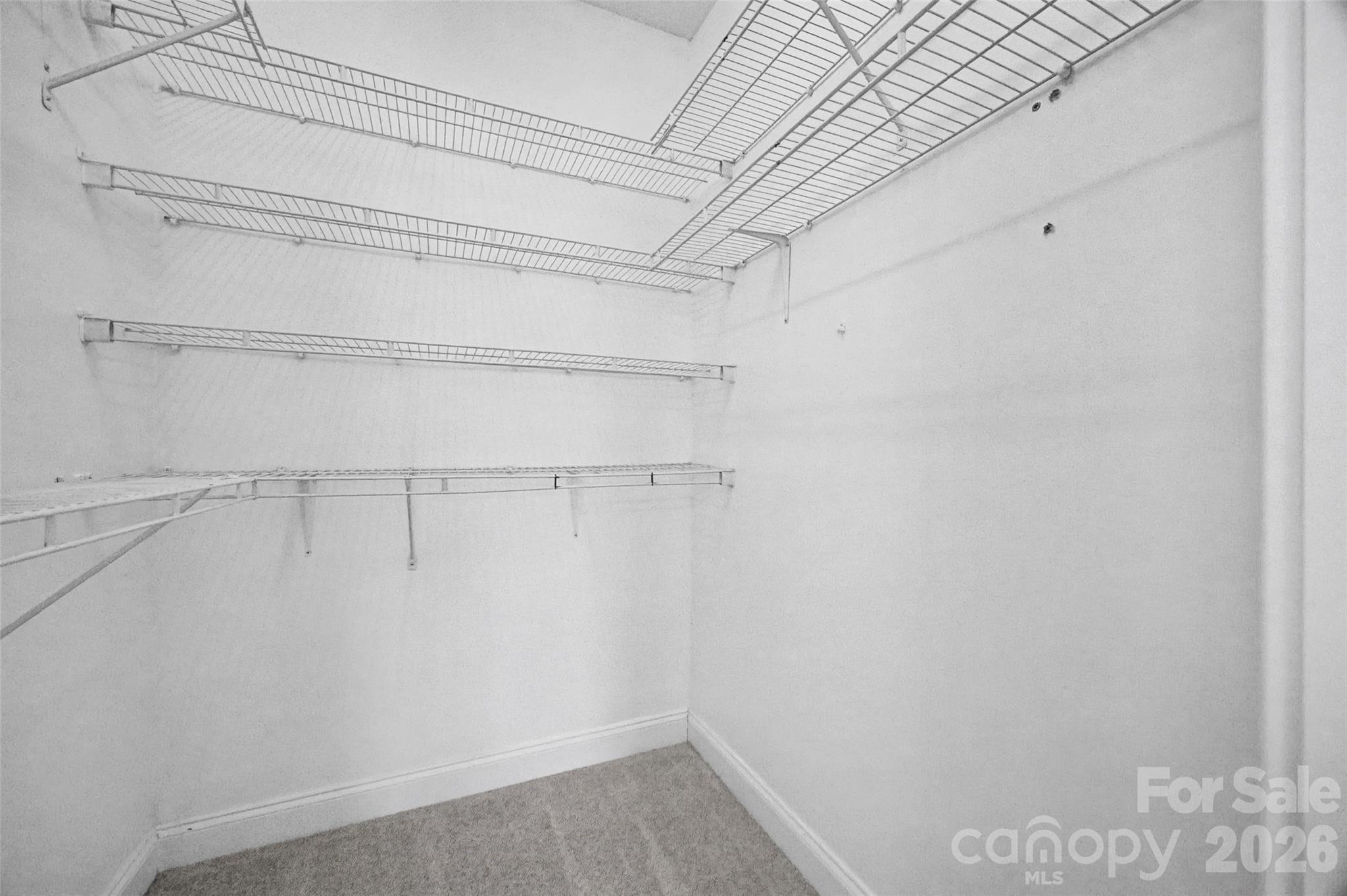8123 Bud Henderson Road Huntersville, NC 28078 - Photo 29 of 48 a view of a room with racks on the wall