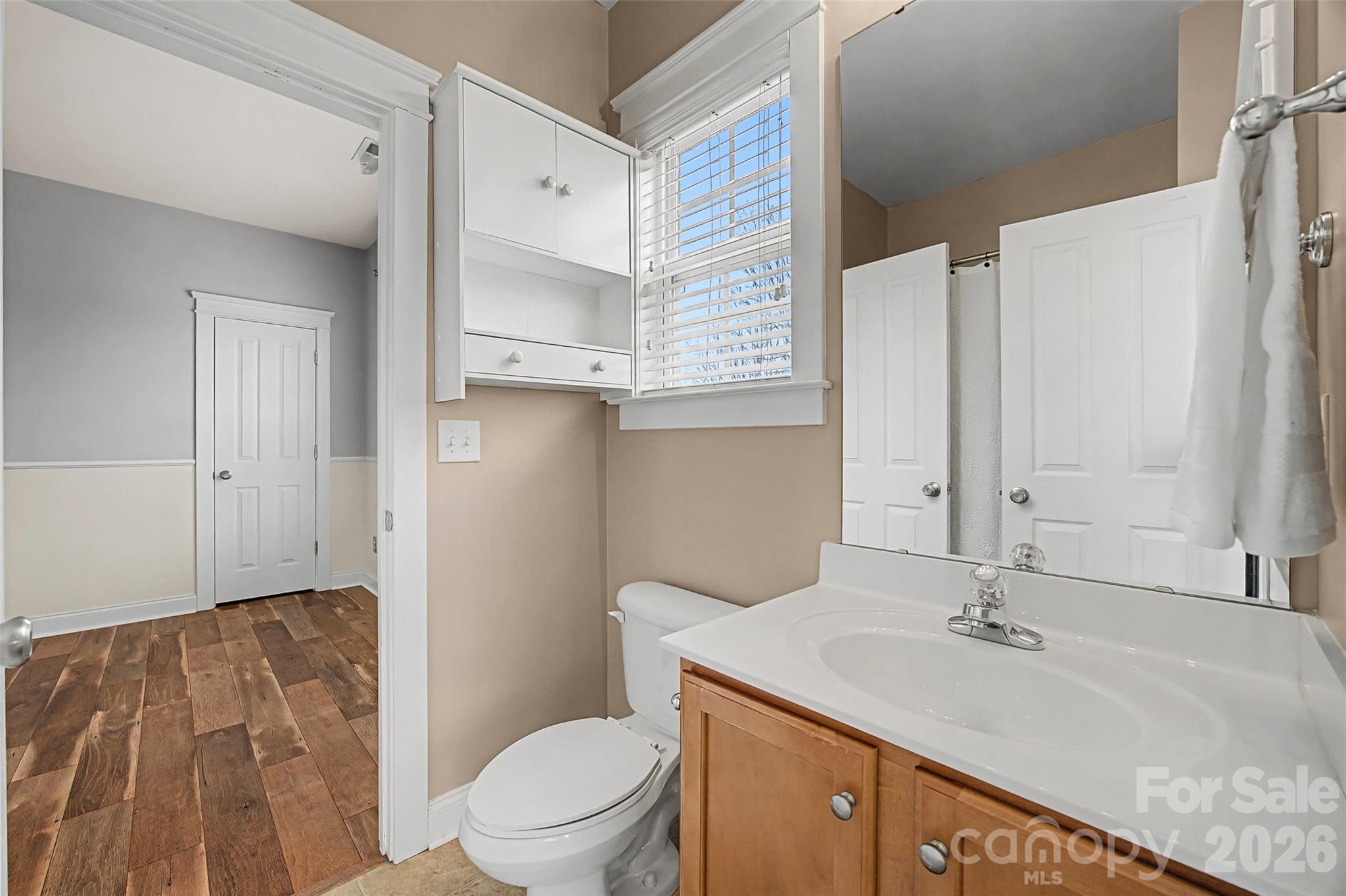 8123 Bud Henderson Road Huntersville, NC 28078 - Photo 34 of 48 a bathroom with a sink a toilet and shower