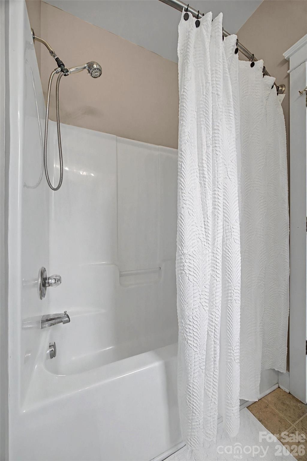 8123 Bud Henderson Road Huntersville, NC 28078 - Photo 35 of 48 a bathroom with a shower and a bathtub