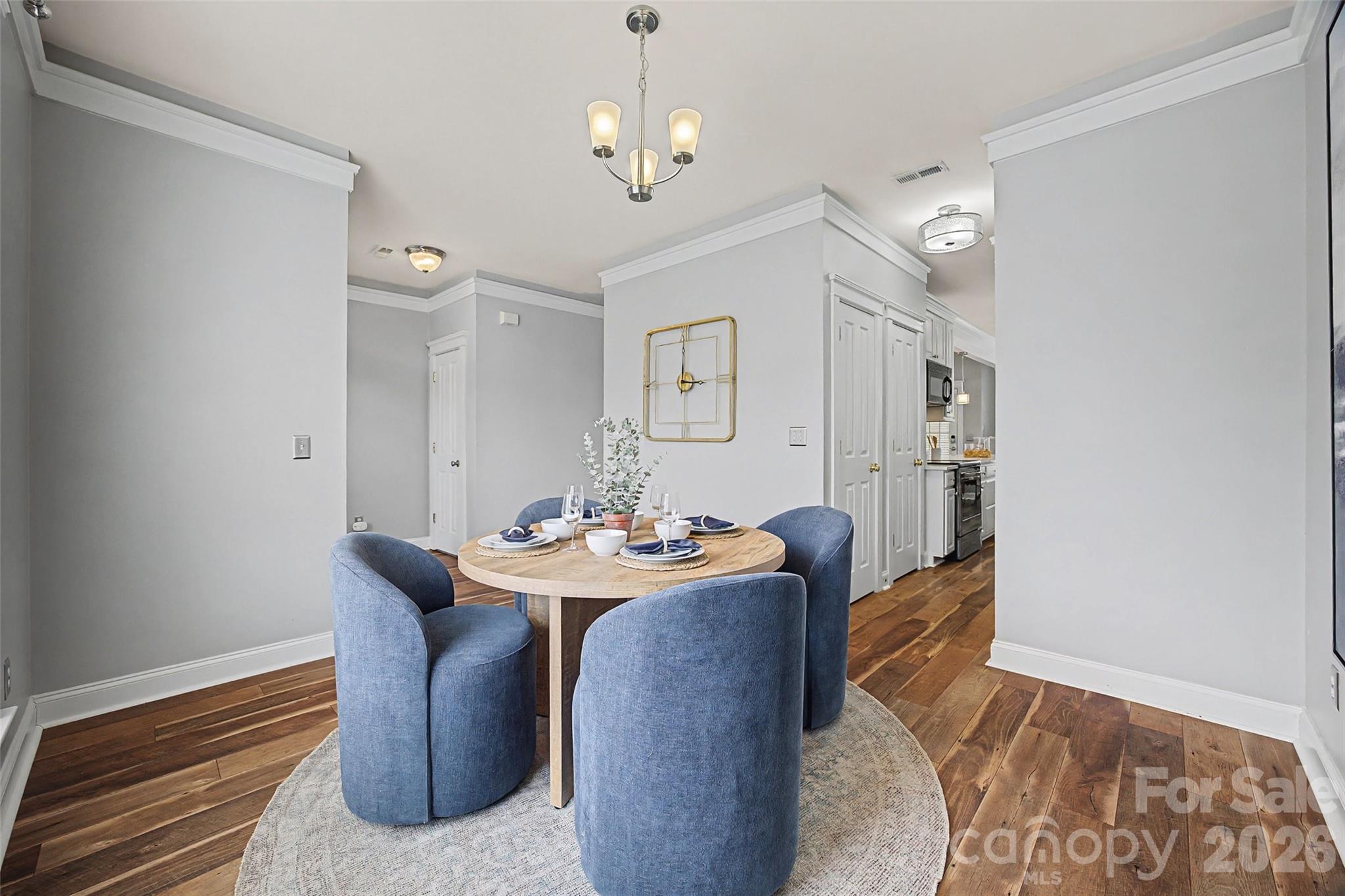 8123 Bud Henderson Road Huntersville, NC 28078 - Photo 7 of 48 a view of a dining room with furniture and wooden floor