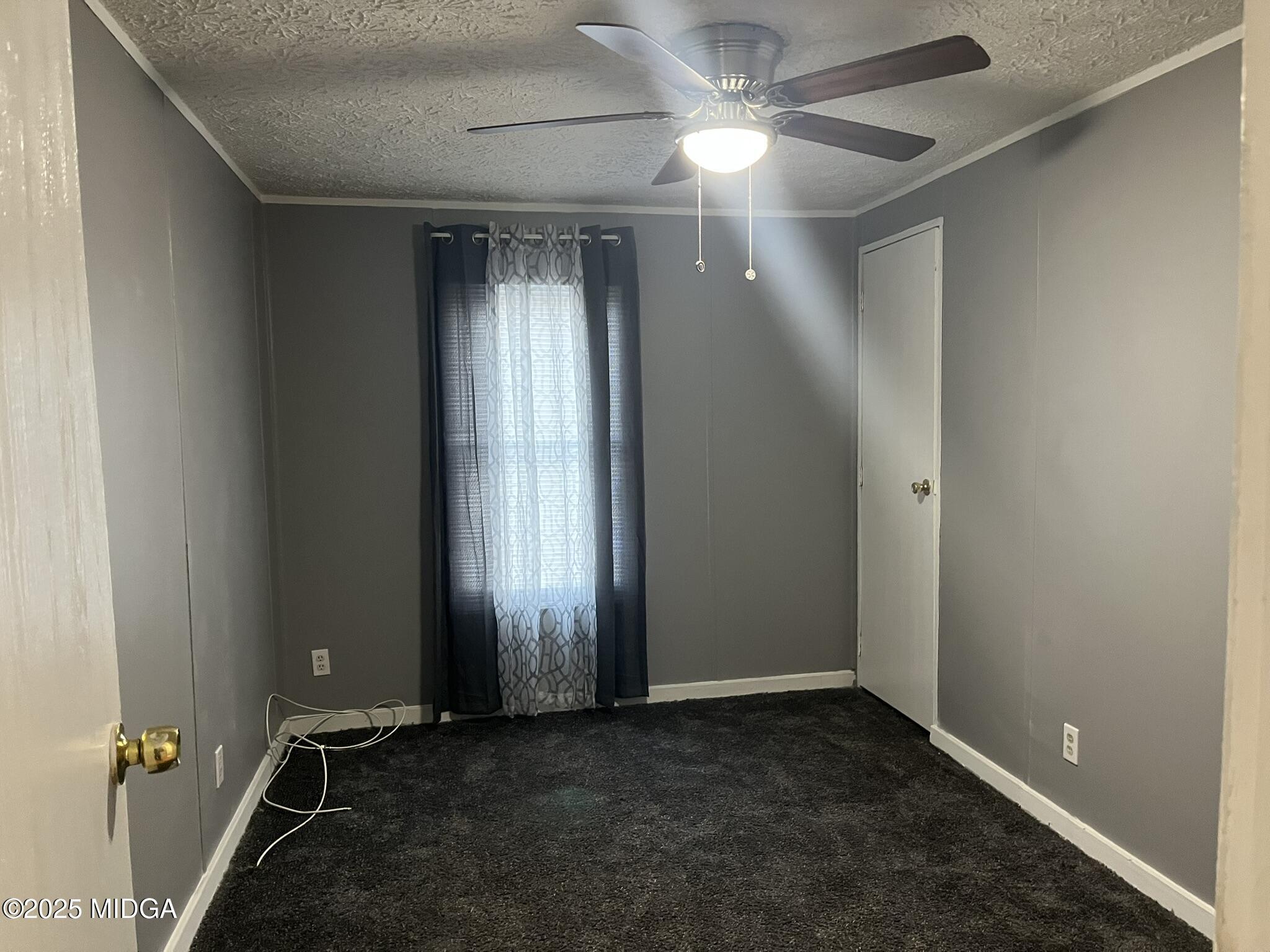 111 Mandy Court Macon, GA 31217 - Photo 11 of 12 an empty room with windows and fan