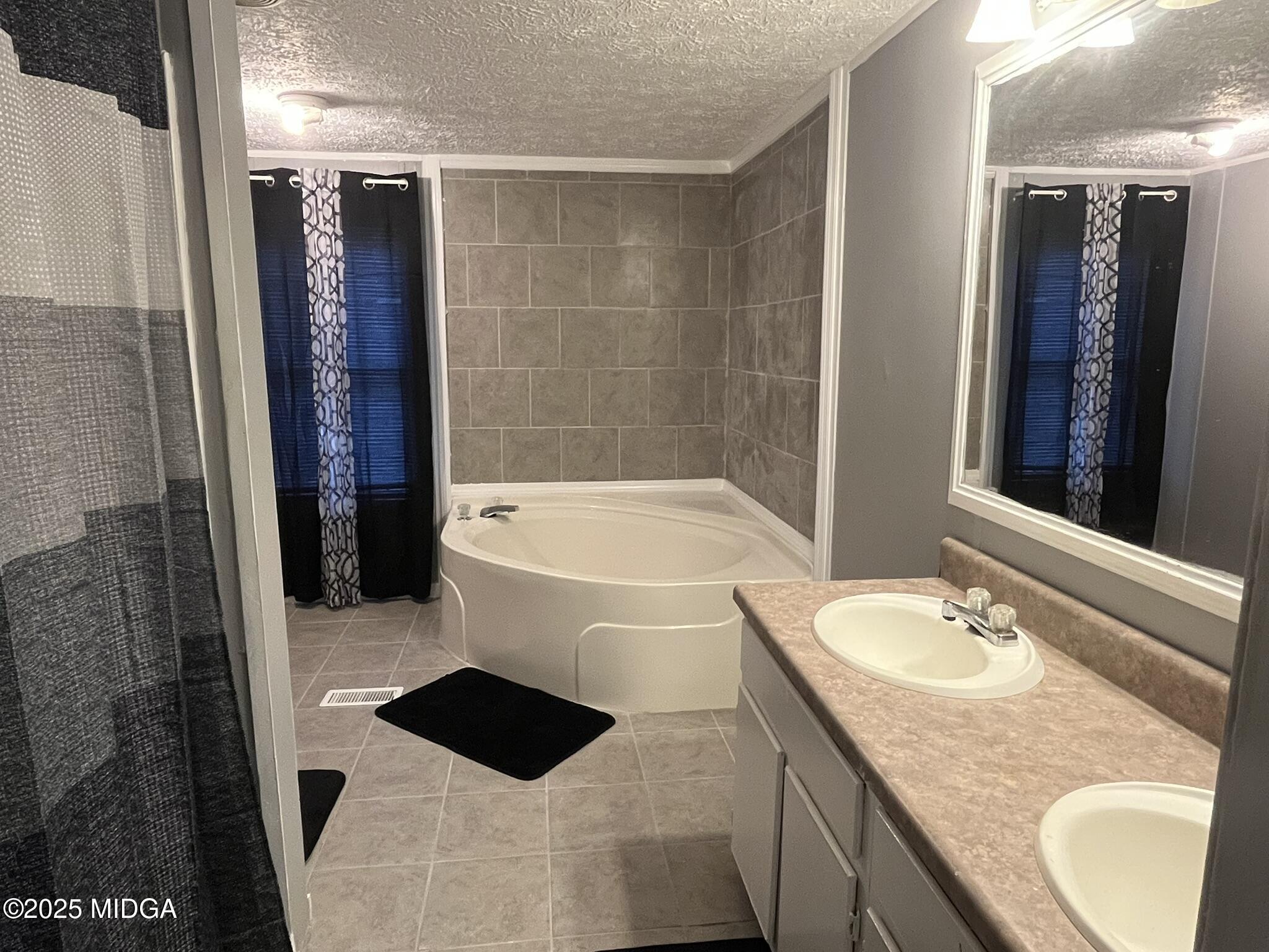 111 Mandy Court Macon, GA 31217 - Photo 3 of 12 a bathroom with a granite countertop sink a toilet and shower