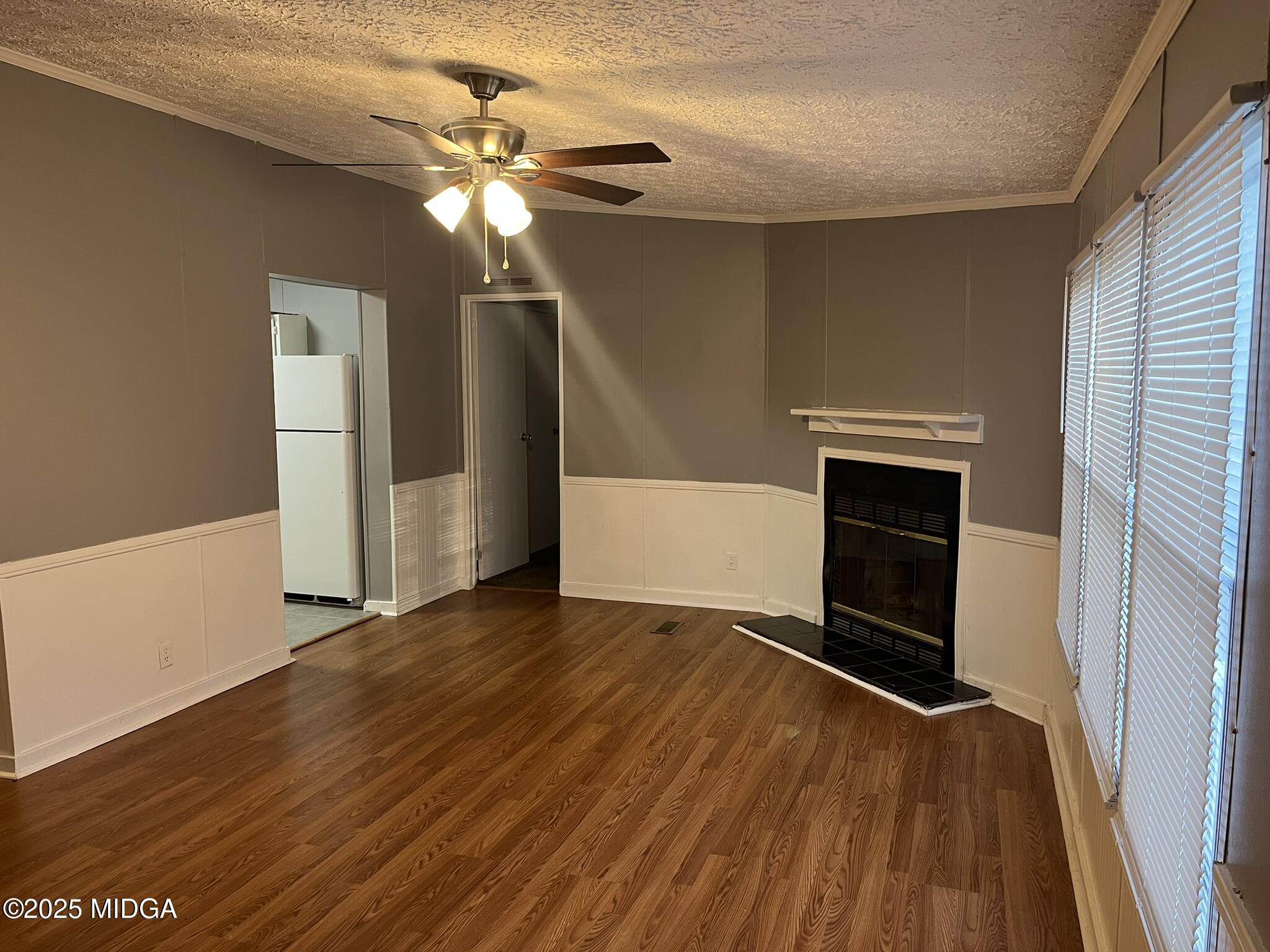 111 Mandy Court Macon, GA 31217 - Photo 5 of 12 a view of empty room with wooden floor and fan