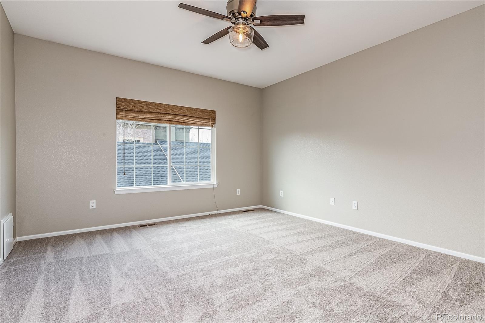592 Brookhurst Avenue, Unit 26B Highlands Ranch, CO 80129 - Photo 13 of 19 a view of an empty room with a window