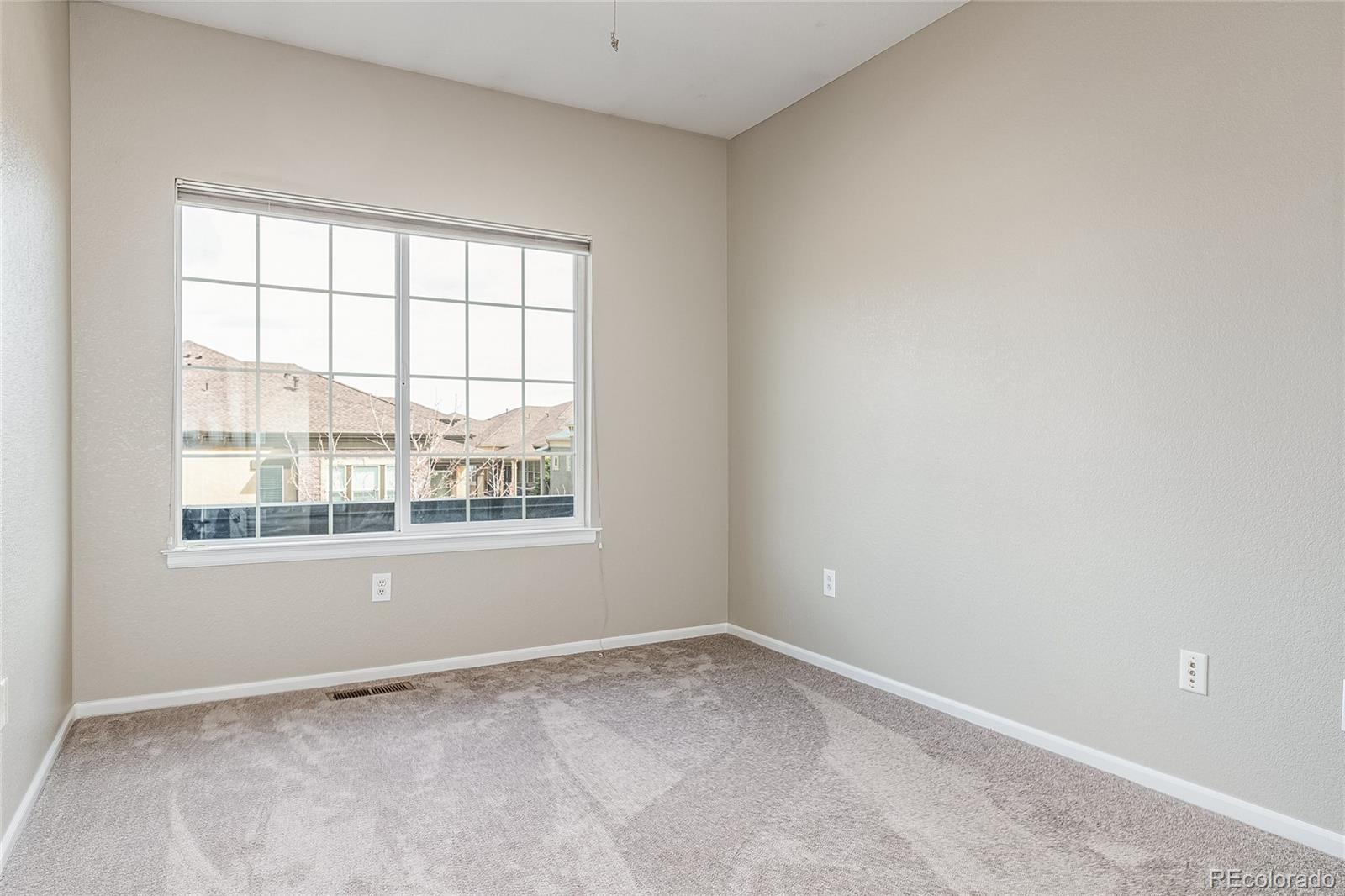 592 Brookhurst Avenue, Unit 26B Highlands Ranch, CO 80129 - Photo 18 of 19 an empty room with a window