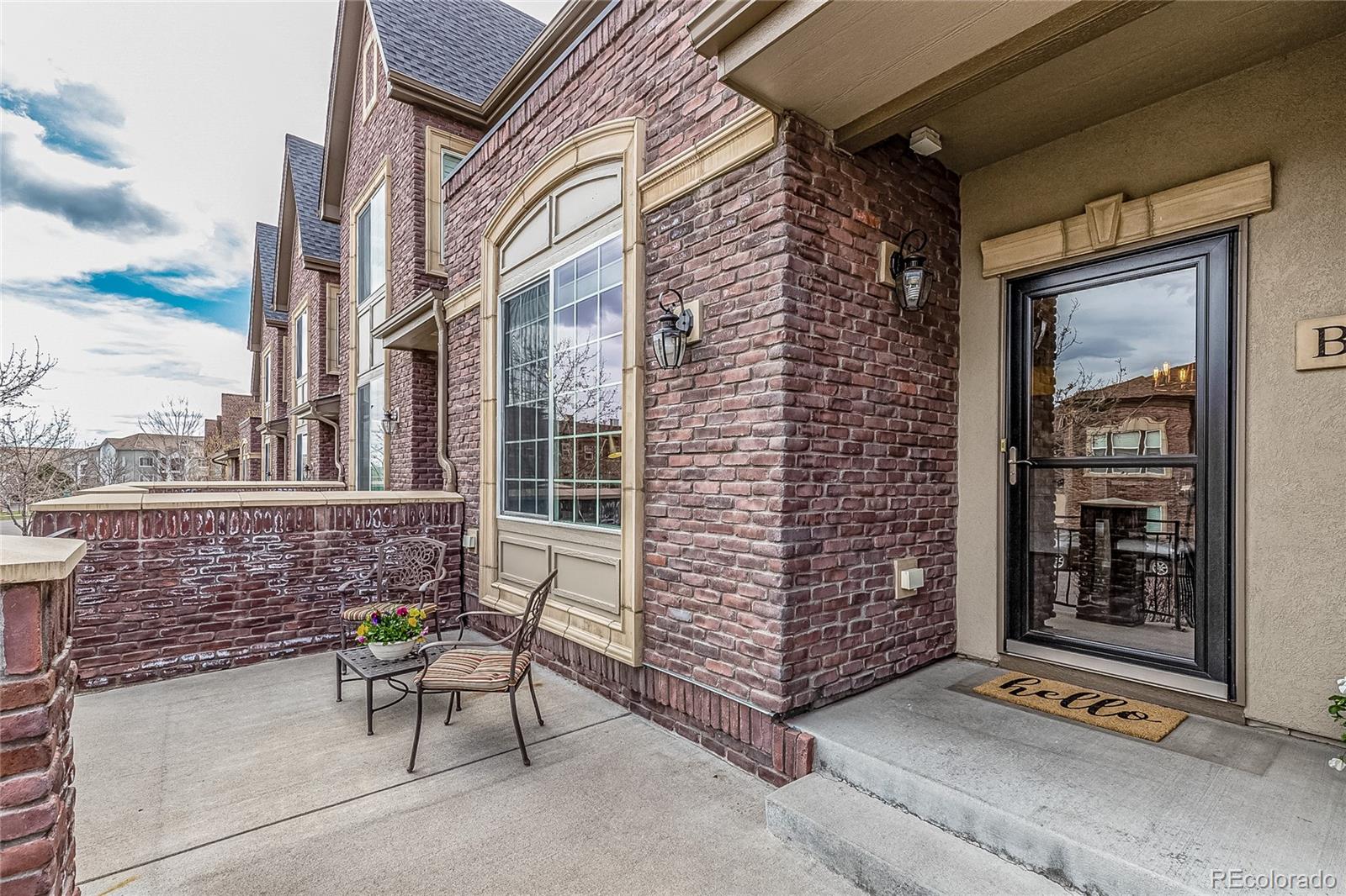 592 Brookhurst Avenue, Unit 26B Highlands Ranch, CO 80129 - Photo 2 of 19 a view of front door and outdoor seating