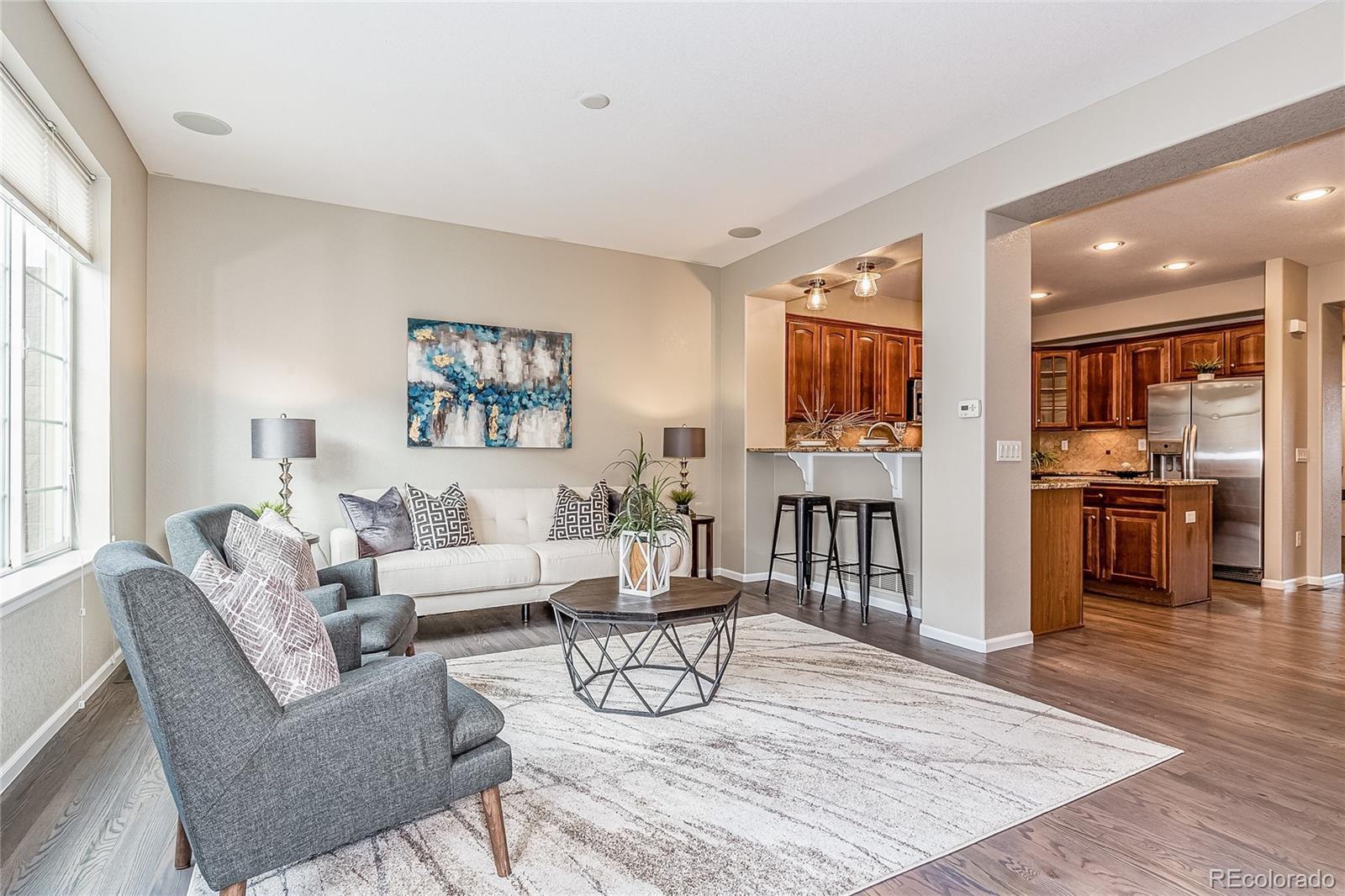 592 Brookhurst Avenue, Unit 26B Highlands Ranch, CO 80129 - Photo 6 of 19 a living room with furniture and wooden floor