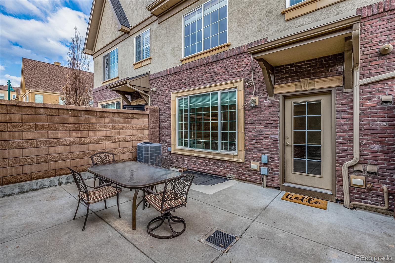 592 Brookhurst Avenue, Unit 26B Highlands Ranch, CO 80129 - Photo 8 of 19 a brick building with a bench and a window
