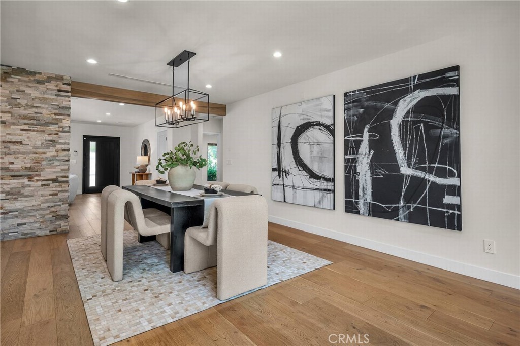 5110 Greenbush Avenue Sherman Oaks, CA 91423 - Photo 11 of 40 a living room with furniture a dining table and a fireplace