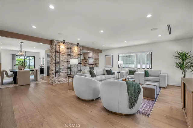 a bathroom with a toilet sink mirror and vanity