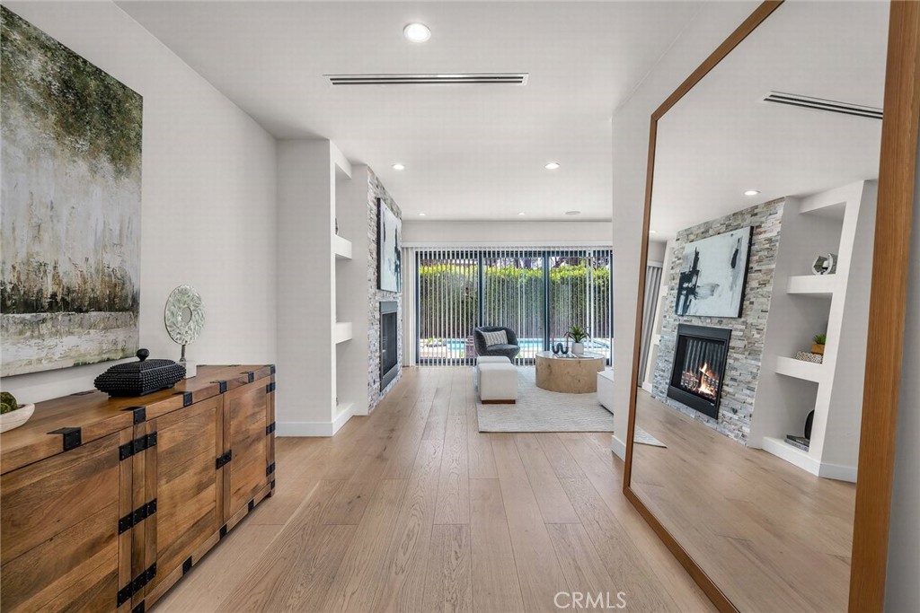 5110 Greenbush Avenue Sherman Oaks, CA 91423 - Photo 17 of 40 a living room with furniture and a fireplace