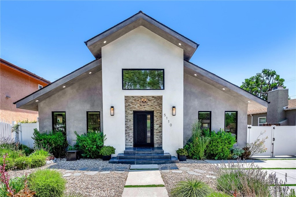 5110 Greenbush Avenue Sherman Oaks, CA 91423 - Photo 2 of 40 a front view of a house with garden