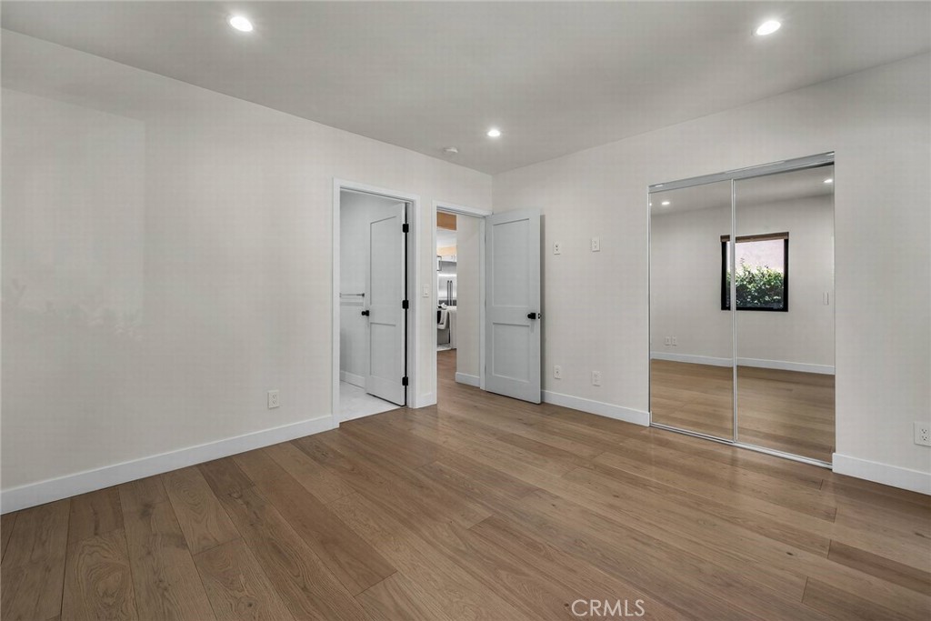 5110 Greenbush Avenue Sherman Oaks, CA 91423 - Photo 23 of 40 wooden floor in an empty room with a window