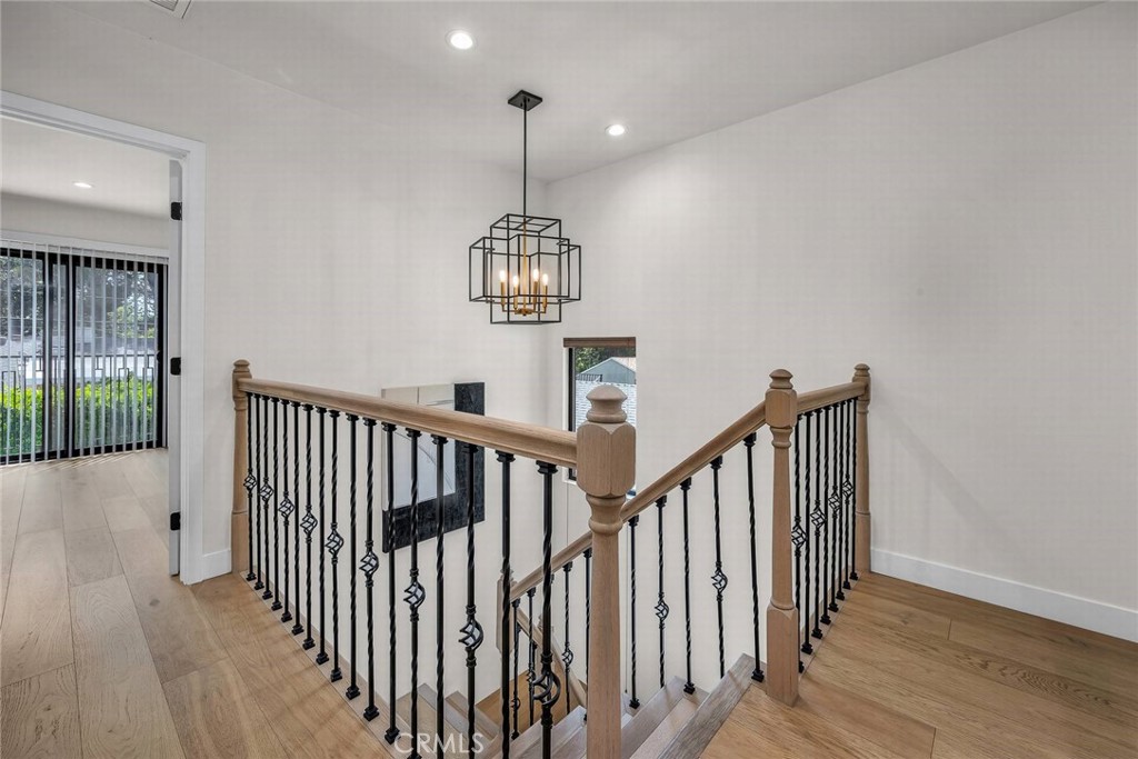 5110 Greenbush Avenue Sherman Oaks, CA 91423 - Photo 27 of 40 a view of a hallway with wooden floor and staircase