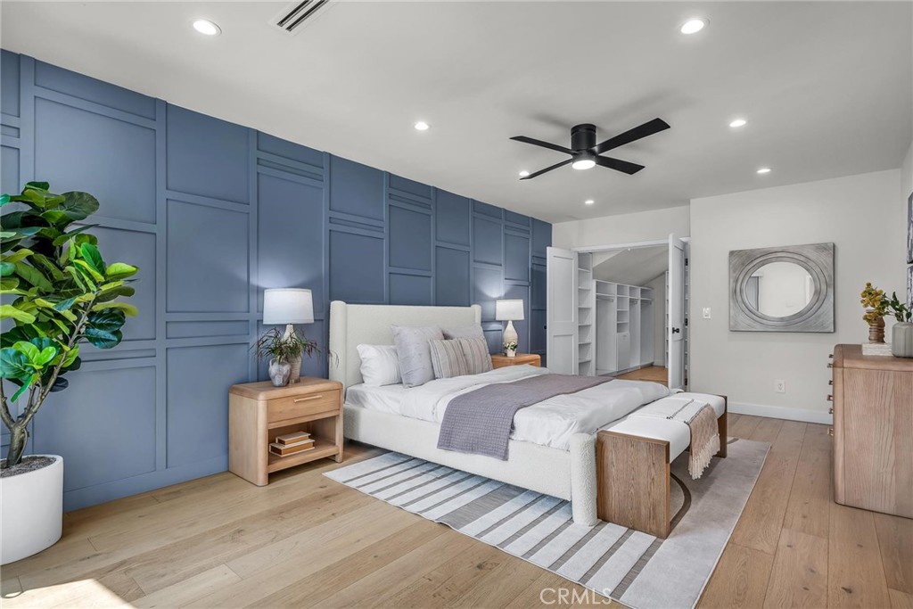 5110 Greenbush Avenue Sherman Oaks, CA 91423 - Photo 28 of 40 a spacious bedroom with a bed and a potted plant
