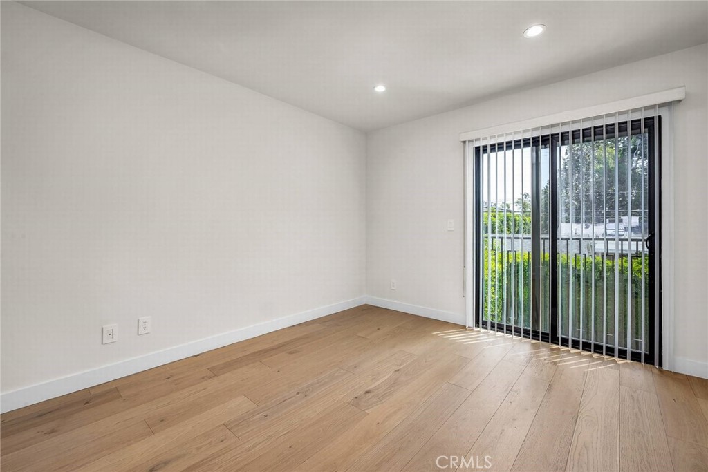 5110 Greenbush Avenue Sherman Oaks, CA 91423 - Photo 32 of 40 wooden floor in an empty room with a window