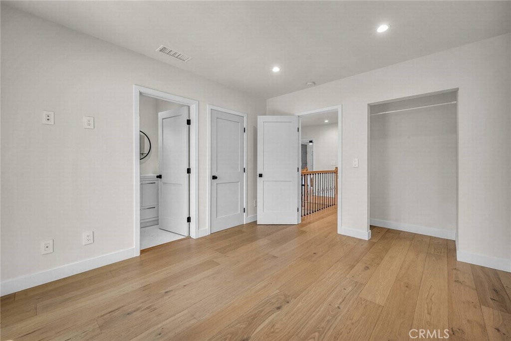 5110 Greenbush Avenue Sherman Oaks, CA 91423 - Photo 33 of 40 a view of an empty room with wooden floor
