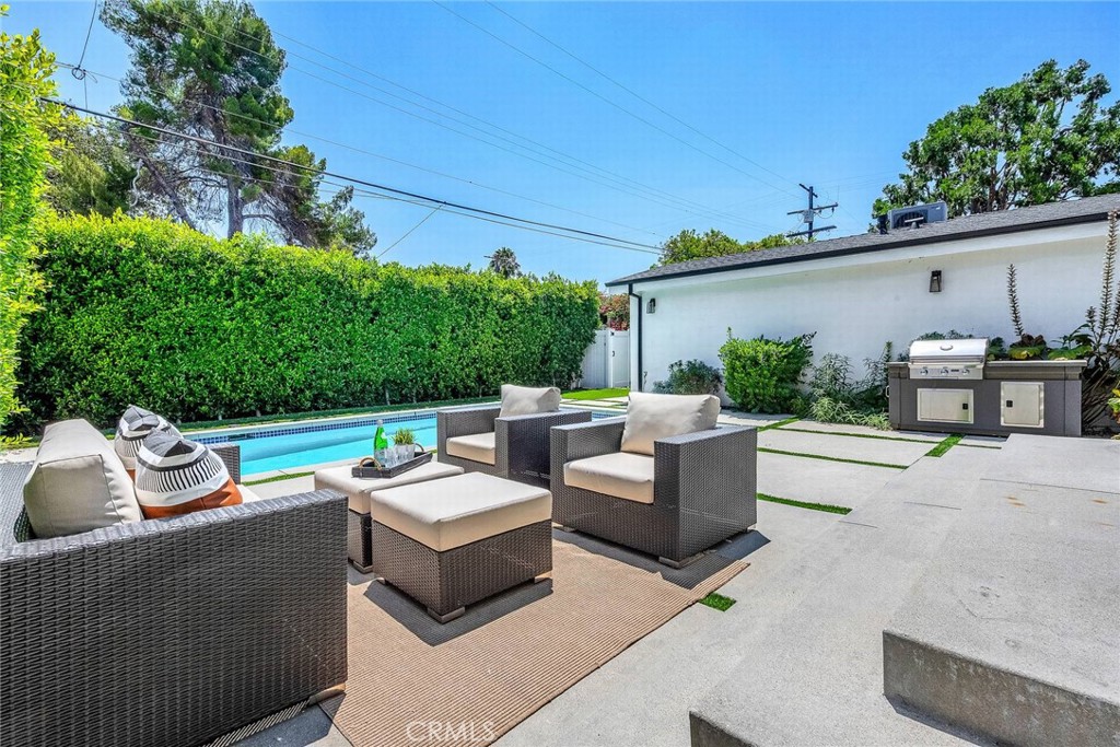 5110 Greenbush Avenue Sherman Oaks, CA 91423 - Photo 36 of 40 a view of a patio with couches table and chairs and potted plants