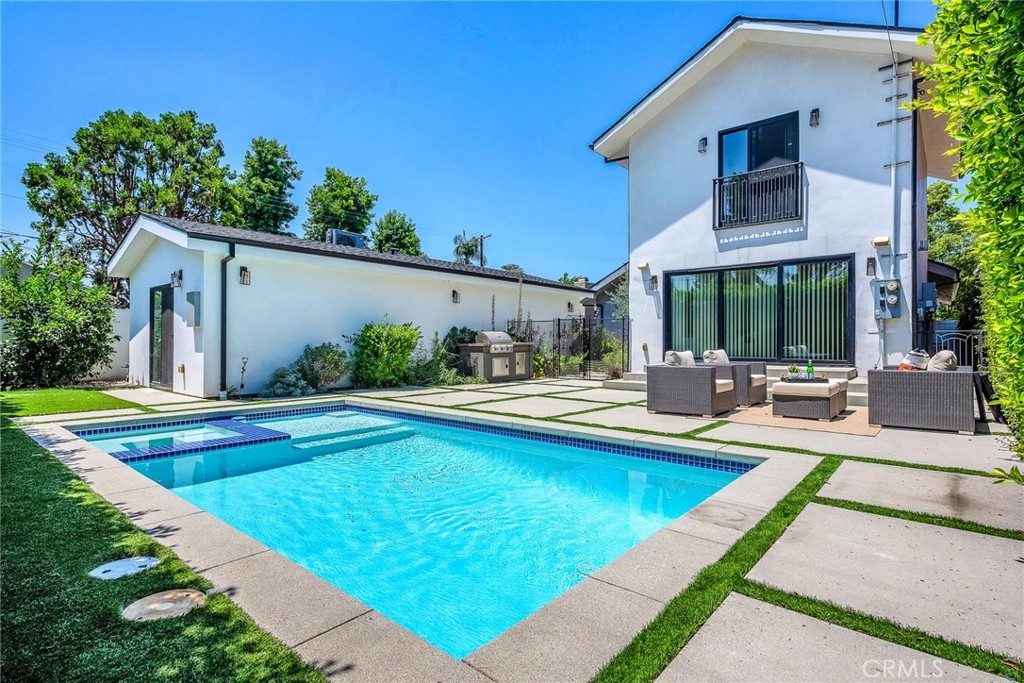 5110 Greenbush Avenue Sherman Oaks, CA 91423 - Photo 38 of 40 a view of swimming pool with outdoor seating and house in the background