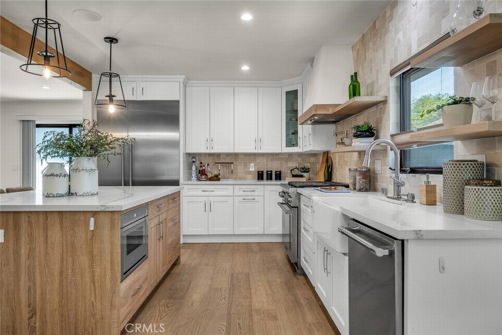 5110 Greenbush Avenue Sherman Oaks, CA 91423 - Photo 7 of 40 a kitchen with stainless steel appliances granite countertop a sink a stove and a refrigerator