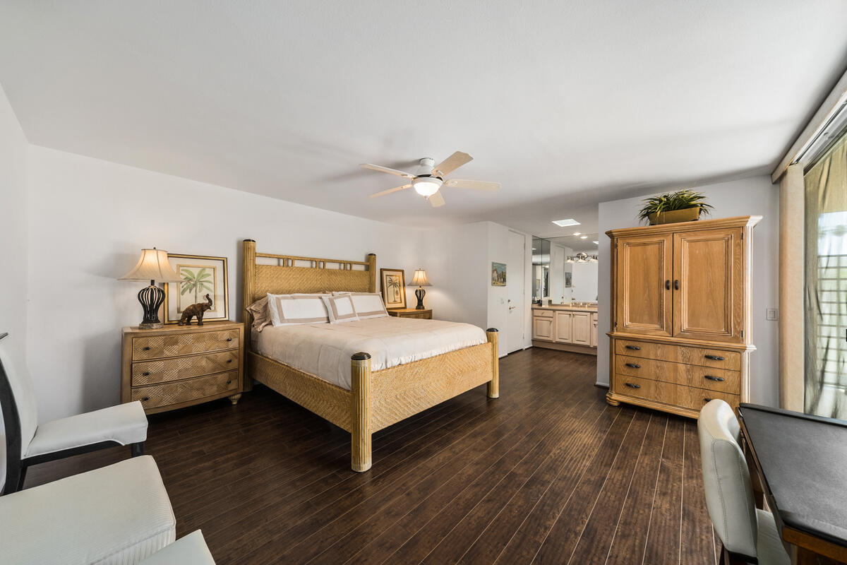 76895 Lark Drive Indian Wells, CA 92210 - Photo 14 of 25 a bedroom with a bed and wooden floor