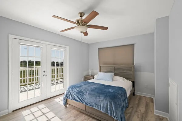 a bedroom with a large bed and a window