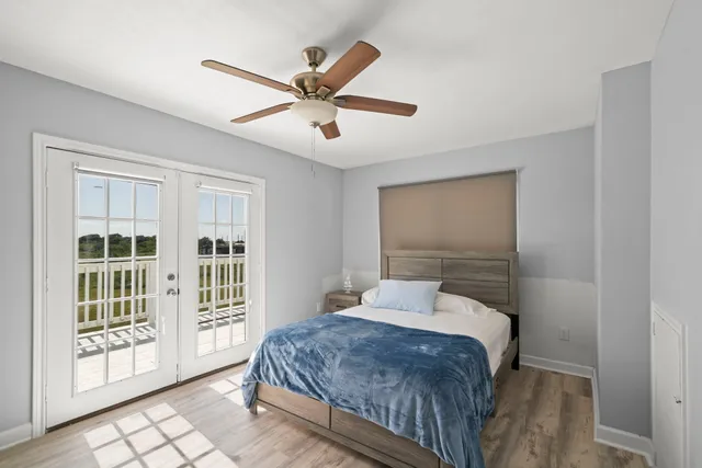 a bedroom with a large bed and a window