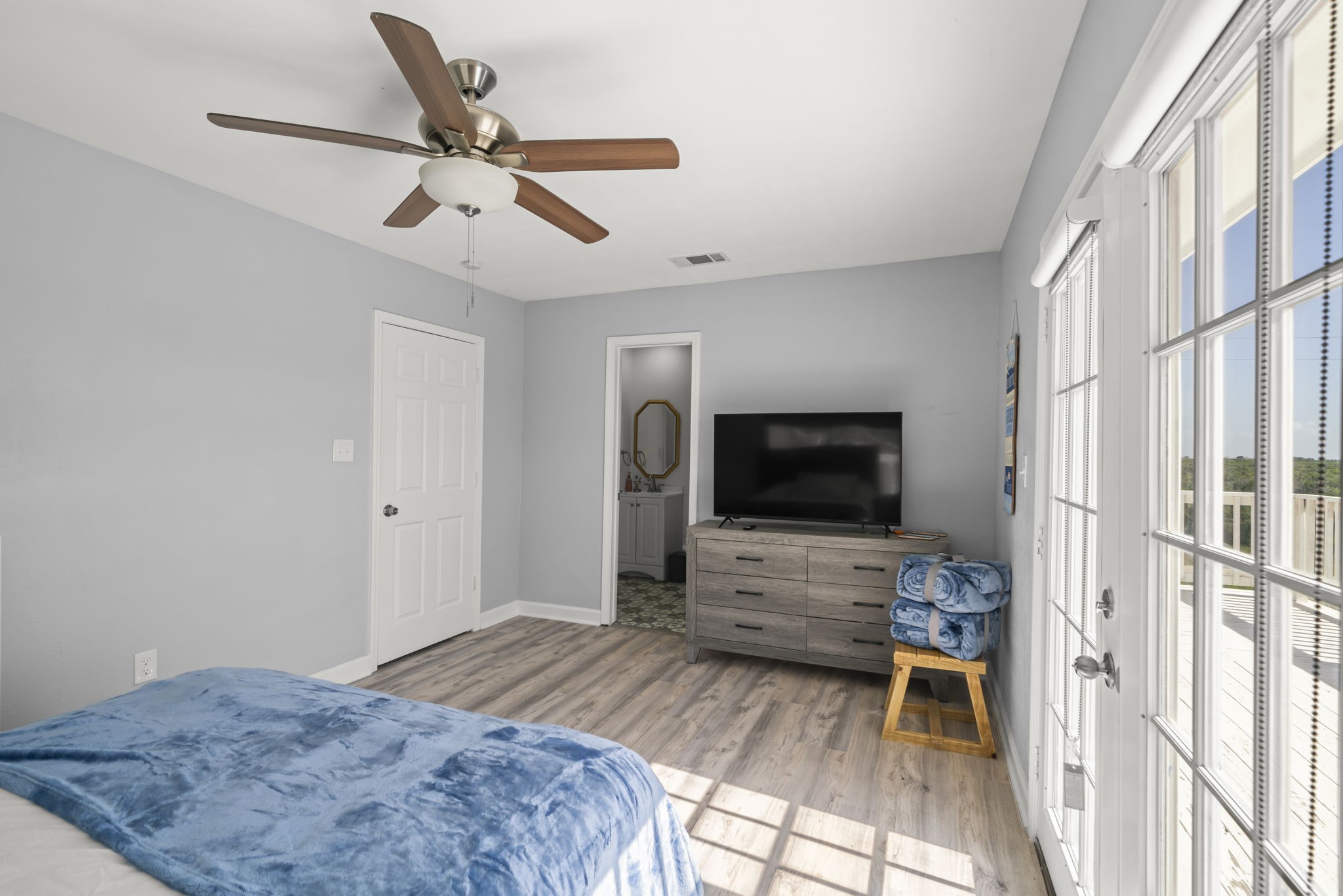 3582 County Road 476 Palacios, TX 77465 - Photo 13 of 31 a bedroom with a bed and a flat screen tv