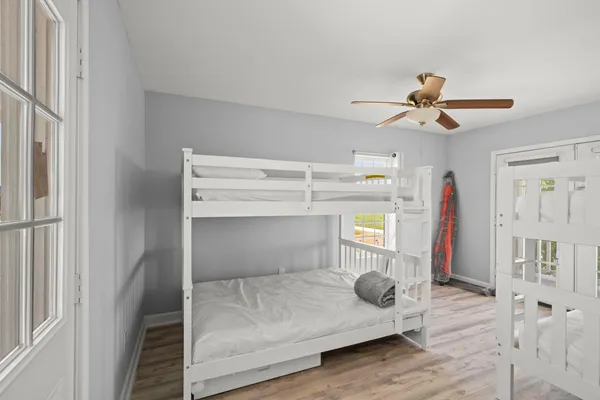 a bedroom with a bed and a chandelier