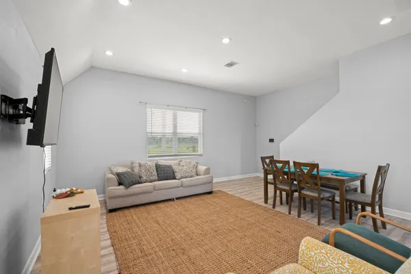 a living room with furniture and a large window