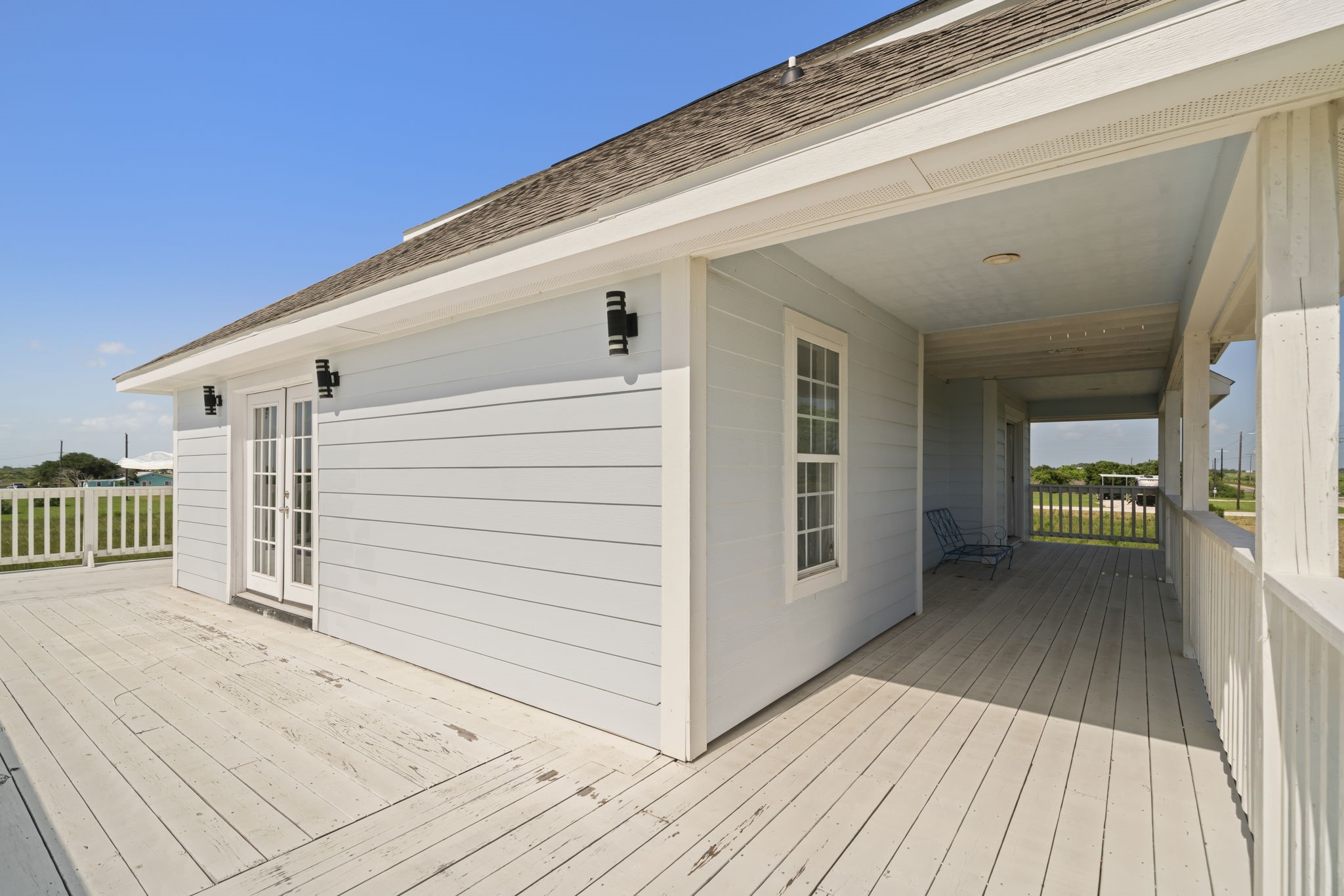 3582 County Road 476 Palacios, TX 77465 - Photo 24 of 31 a view of a porch with wooden floor and fence