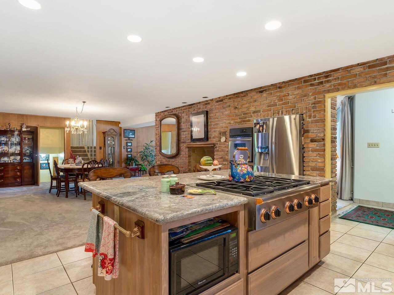 2125 Lakeside Drive Reno, NV 89509 - Photo 15 of 33 a kitchen that has a stove and a table