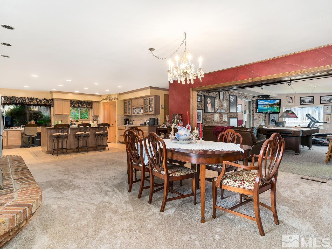 2125 Lakeside Drive Reno, NV 89509 - Photo 17 of 33 a view of a dining room with furniture and chandelier
