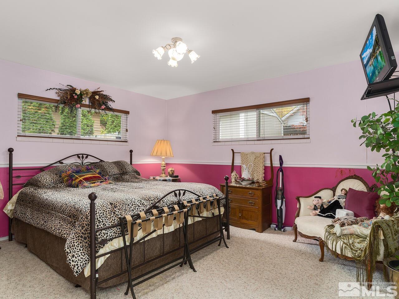 2125 Lakeside Drive Reno, NV 89509 - Photo 22 of 33 a bedroom with bed and a chandelier