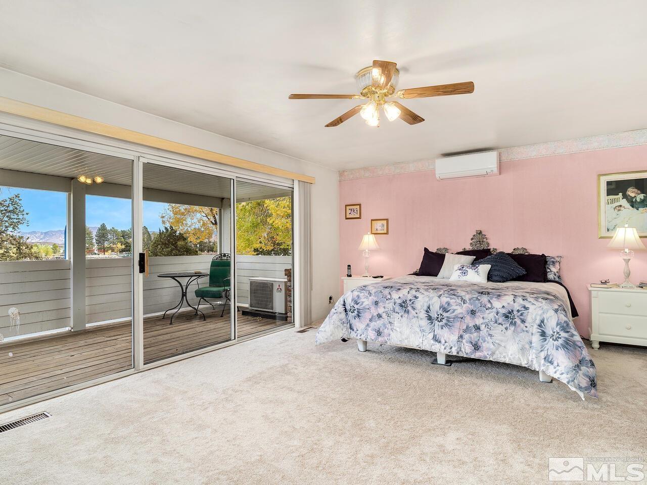 2125 Lakeside Drive Reno, NV 89509 - Photo 23 of 33 a bedroom with a bed and a large window
