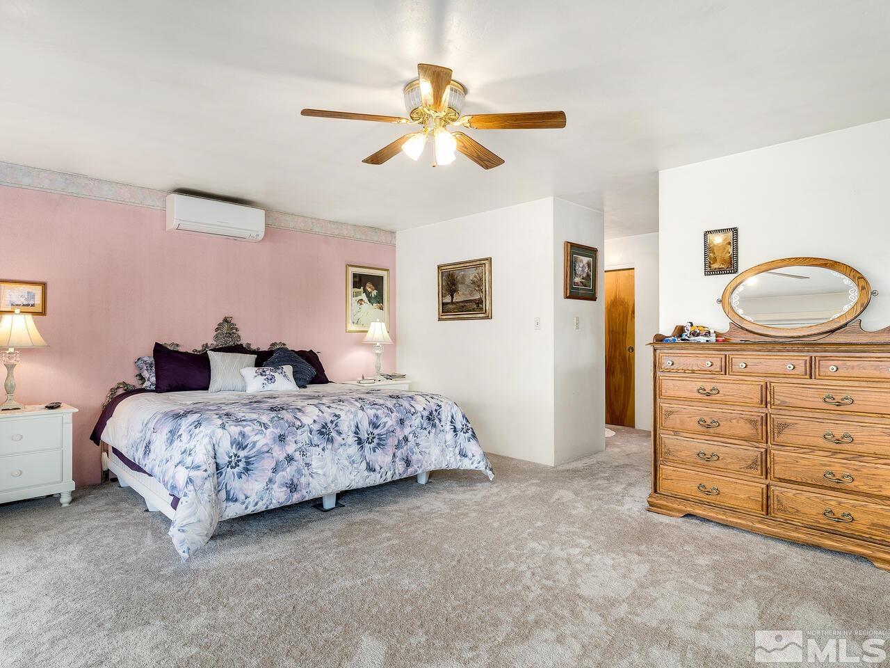 2125 Lakeside Drive Reno, NV 89509 - Photo 25 of 33 a spacious bedroom with a bed and a dresser