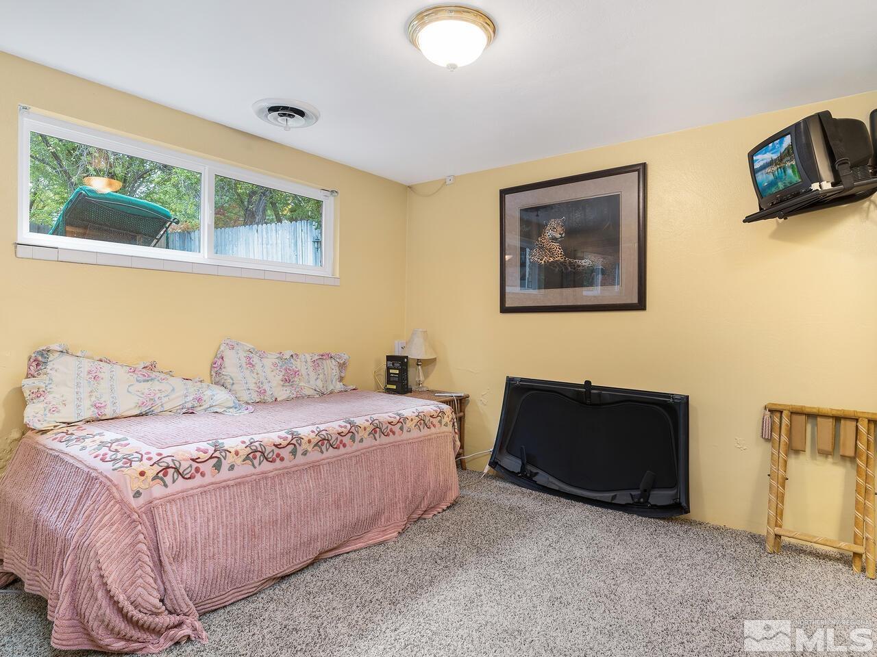 2125 Lakeside Drive Reno, NV 89509 - Photo 26 of 33 a bedroom with a bed and a couch