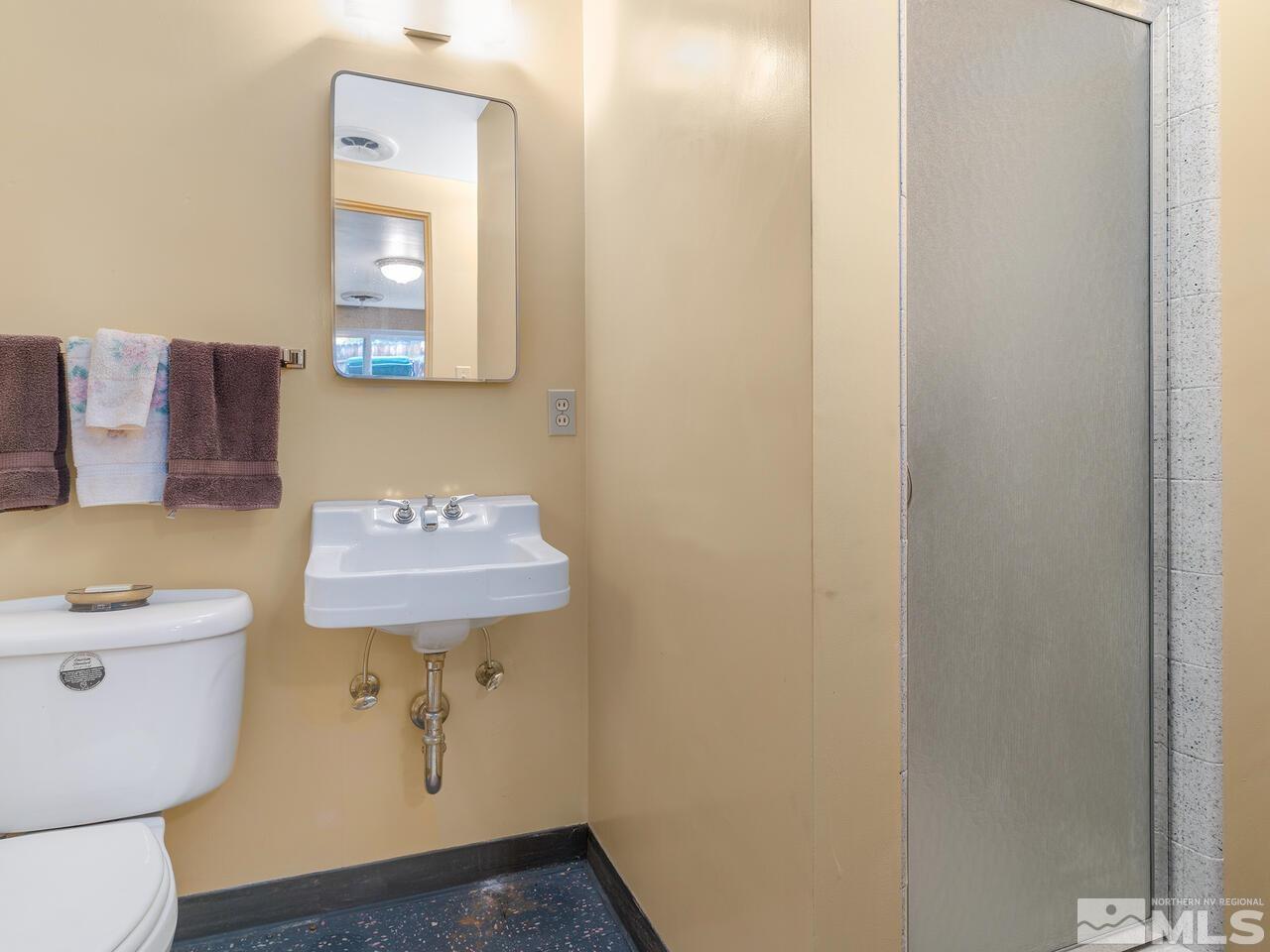 2125 Lakeside Drive Reno, NV 89509 - Photo 27 of 33 a room with a sink and a mirror