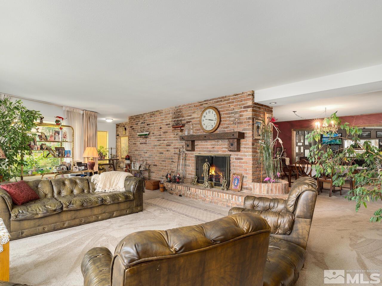 2125 Lakeside Drive Reno, NV 89509 - Photo 3 of 33 a living room with furniture and a fireplace