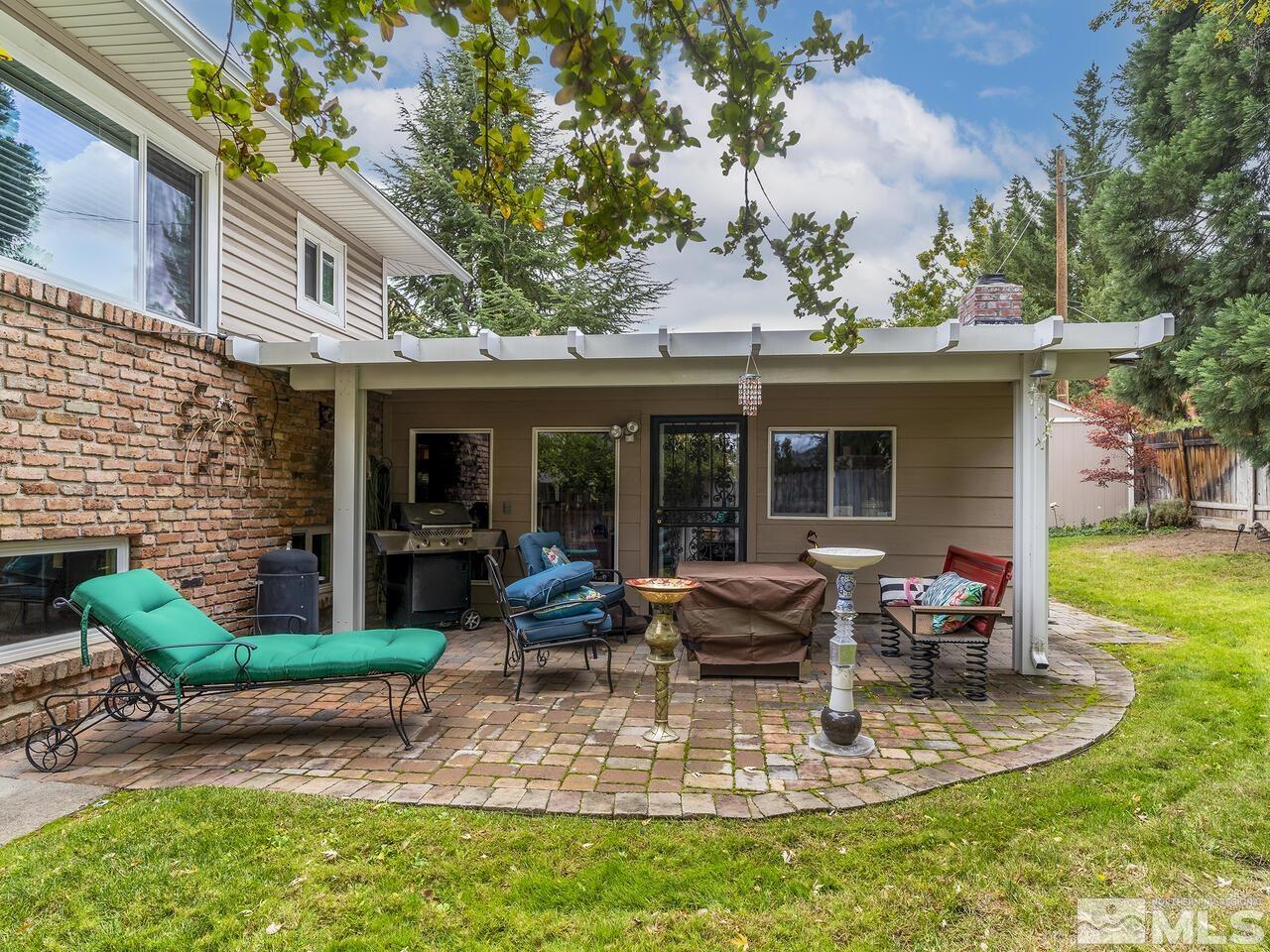 2125 Lakeside Drive Reno, NV 89509 - Photo 31 of 33 a view of a house with backyard outdoor seating area and furniture