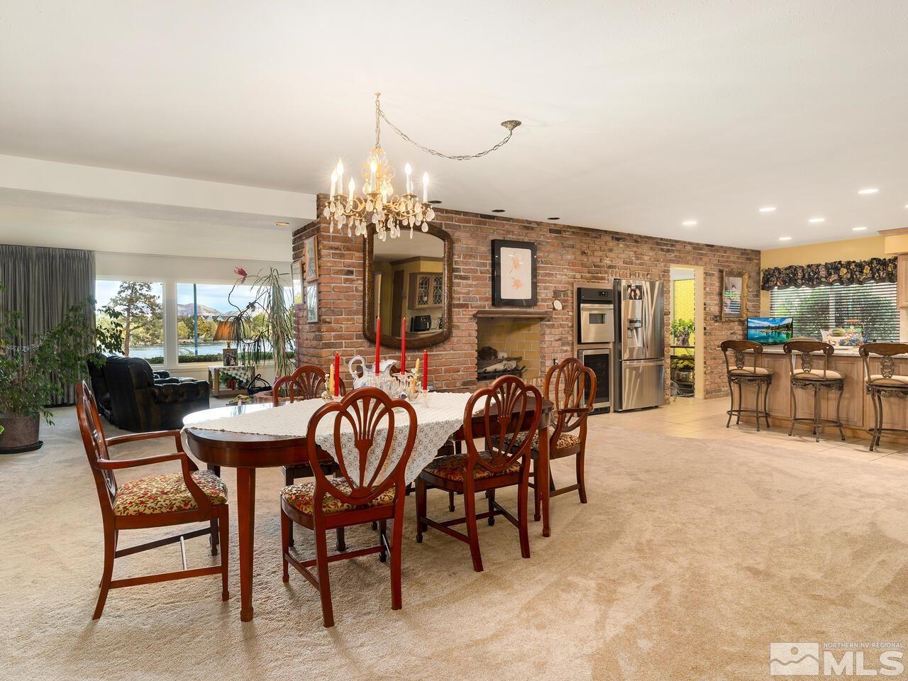 2125 Lakeside Drive Reno, NV 89509 - Photo 7 of 33 a dining room with furniture a chandelier and window