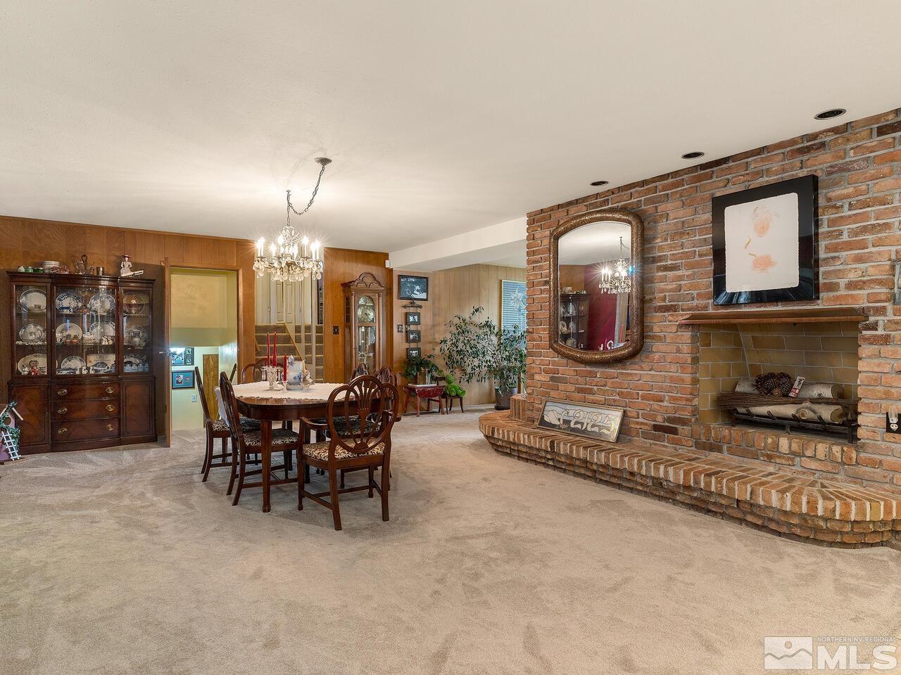 2125 Lakeside Drive Reno, NV 89509 - Photo 8 of 33 a dining room with furniture and a fireplace