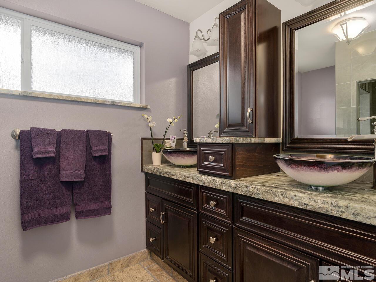 2125 Lakeside Drive Reno, NV 89509 - Photo 10 of 33 a bathroom with a granite countertop sink and a mirror