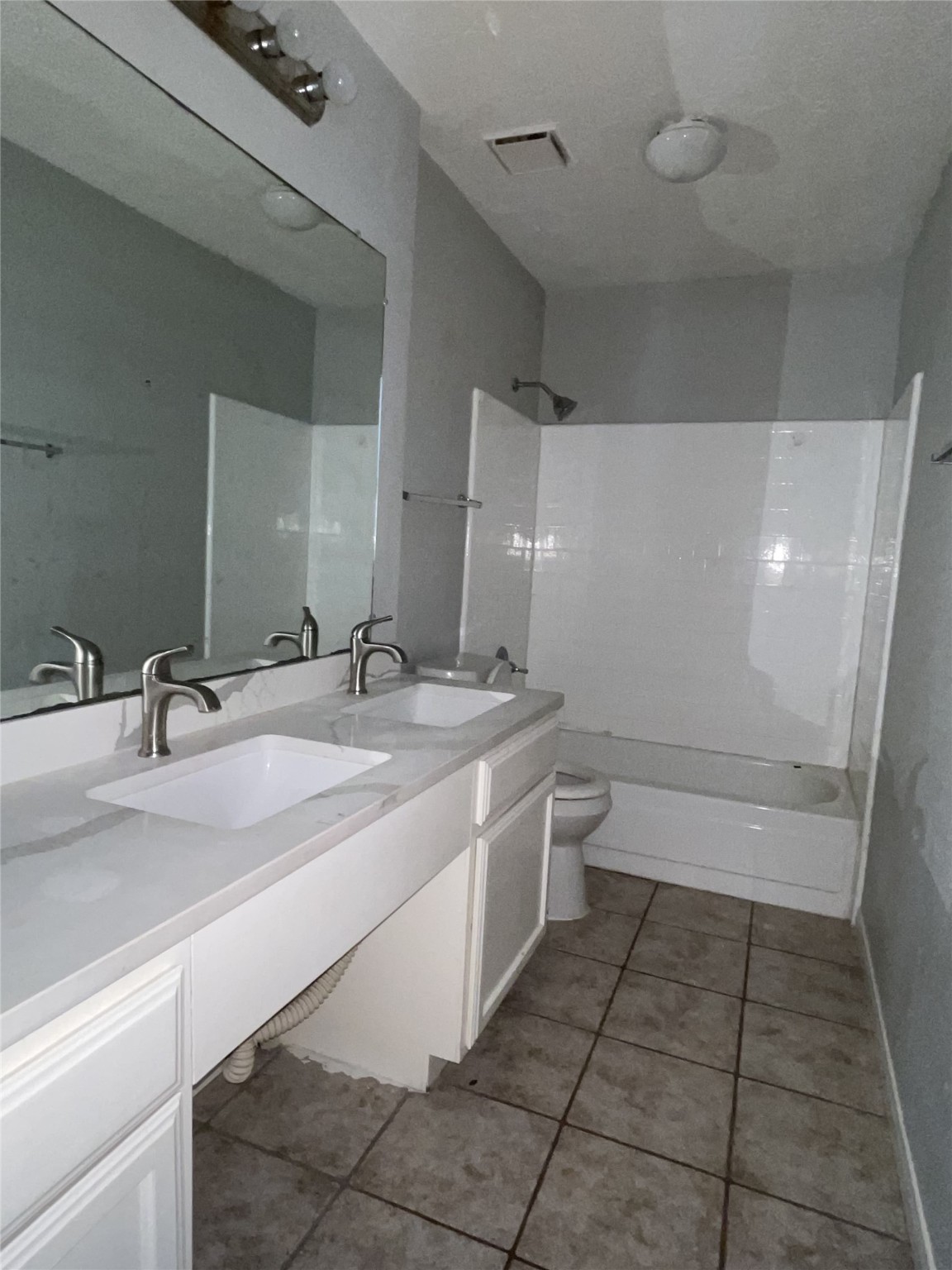 3443 Nutwood Lane Spring, TX 77389 - Photo 8 of 8 a bathroom with a granite countertop sink a toilet and a mirror