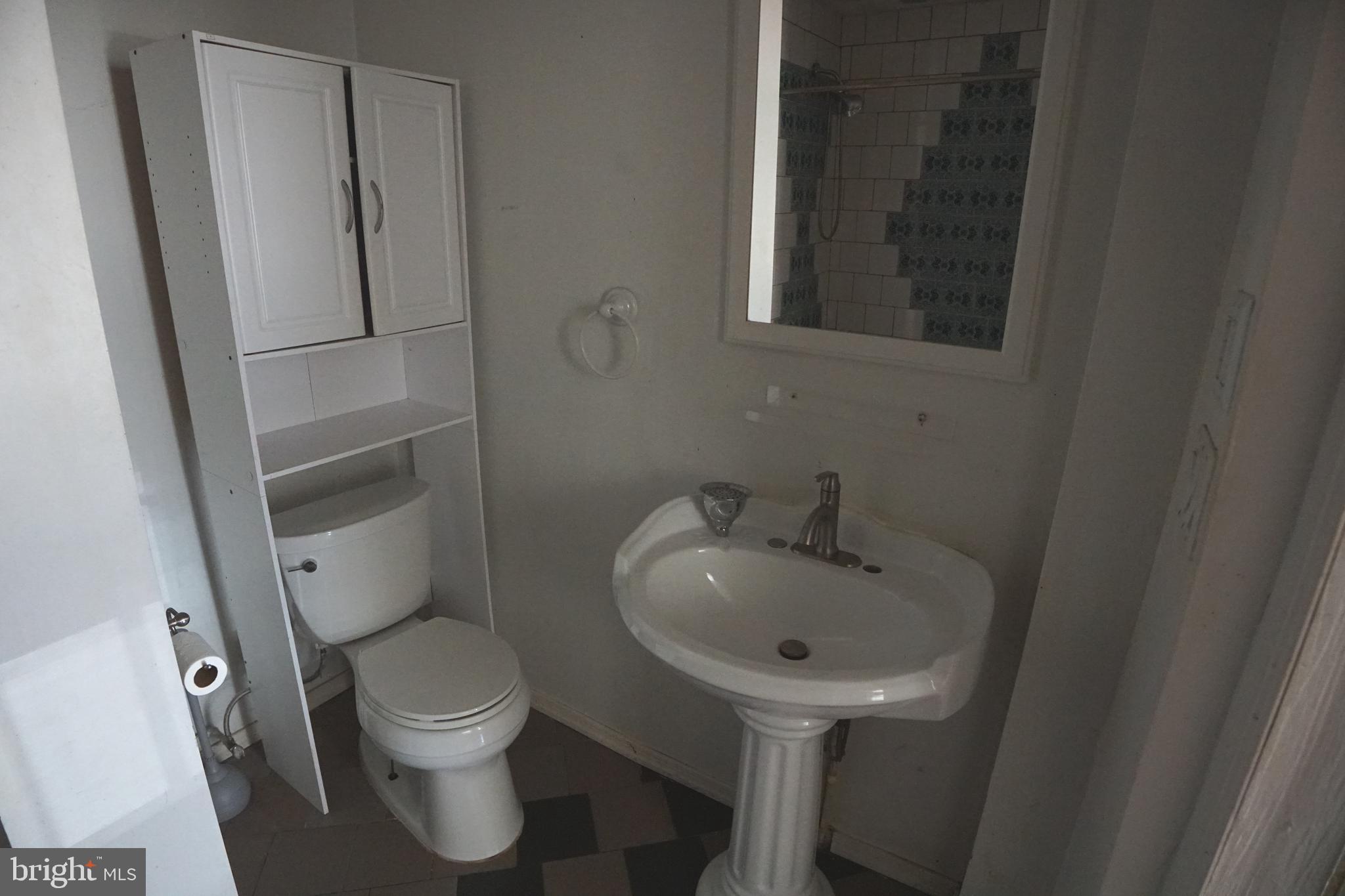 804 Cathedral Street, Unit 7 Baltimore, MD 21201 - Photo 14 of 22 a bathroom with a toilet sink and shower