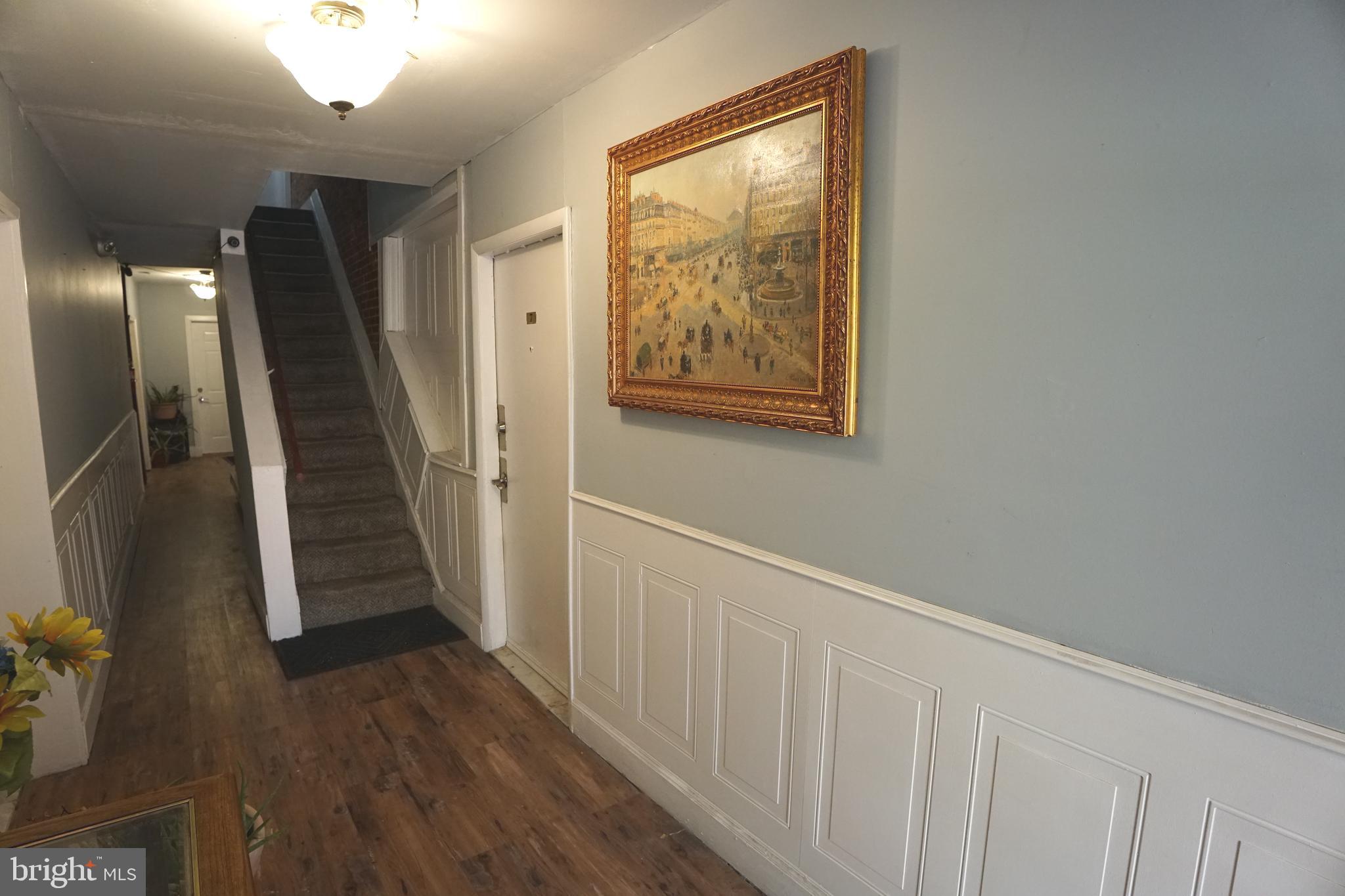 804 Cathedral Street, Unit 7 Baltimore, MD 21201 - Photo 18 of 22 workspace with wooden floor and stairs