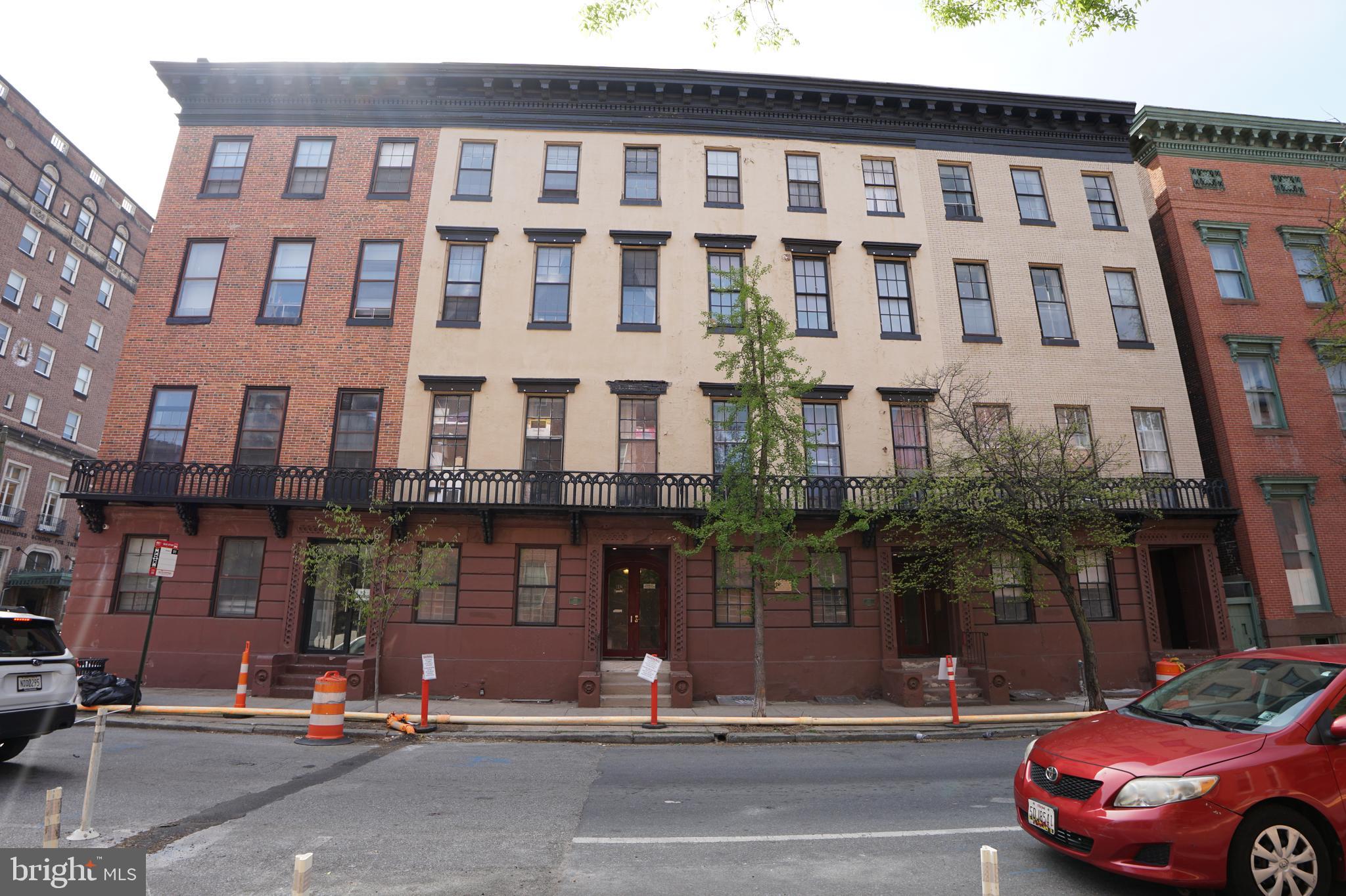 804 Cathedral Street, Unit 7 Baltimore, MD 21201 - Photo 19 of 22 a cars parked in front of a building
